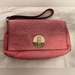 Kate Spade pink bag with polka dot lining and wrist strap